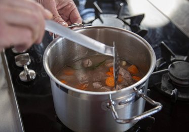 Add the vegetables and herbs and bring to the boil