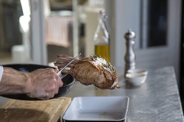 Remove the frenched rack from the casserole dish
