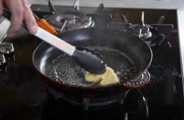 Put the butter into the frying pan