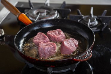 Put the veal tenderloin into the frying pan