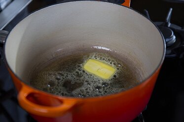 Put the butter into the casserole dish