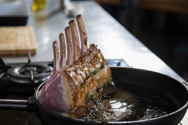 Fry the frenched rack for three to four minutes until golden brown on the outside