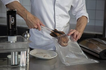 Place the veal into a vacuum-sealed bag.