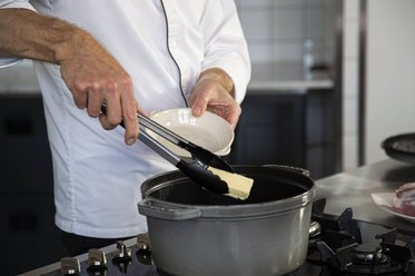Put butter into the casserole dish