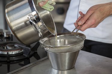 Strain through a fine sieve
