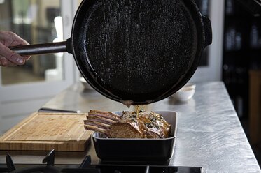 Pour the cooking liquid over the frenched rack