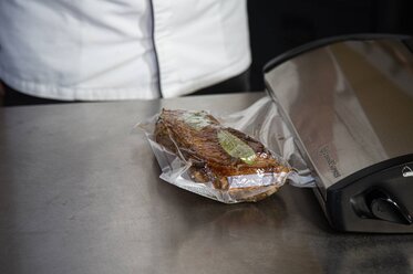 Vacuum-seal the veal with herbs and spices