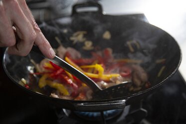 Add the vegetables and continue to stir-fry