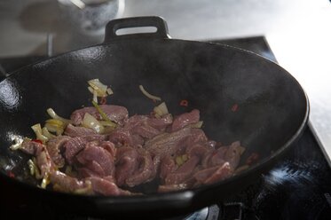 Let the oil heat up and then add the veal