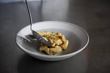 Spoon the veal strips onto a plate