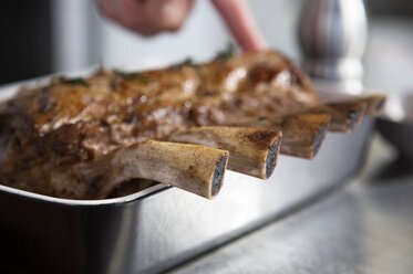 Remove the herbs and garlic from the veal