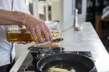 Put the oil into the casserole dish