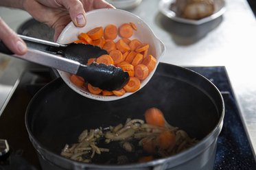 Put the vegetables and herbs into the casserole dish